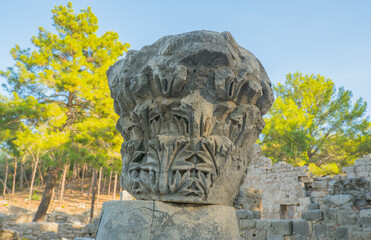 Fototapeta premium Details of the ruins of the ancient city of Phaselis in Lycia in modern Turkey. Remains of columns and capitals