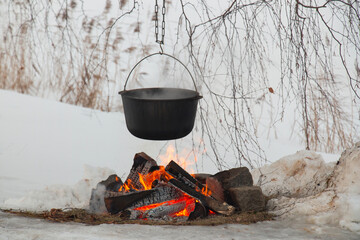 Picnic fire in the snow on a frosty winter day