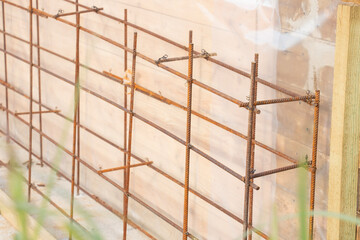 Construction of a new concrete foundation for a residential building at a construction site.