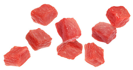 Fresh raw beef pieces flying on white background