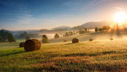 morning sun over misty countryside with hay bales idyllic rural scene for nature prints home decor agricultural posters