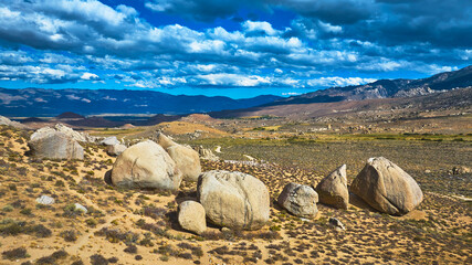 Aerial Buttermilk Boulders and Sierra Mountains Under Dramatic Sky Eastern Sierra © Nicholas J. Klein