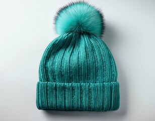 teal pom pom knit hat on white background