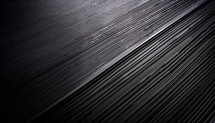 Obraz premium Close Up Of A Textured Black Surface With A Subtle Diagonal Light Gradient Shining Across It