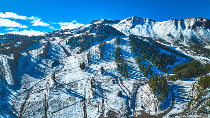 Aerial Mammoth Ski Area Mountain Landscape with Snow and Evergreen Trees