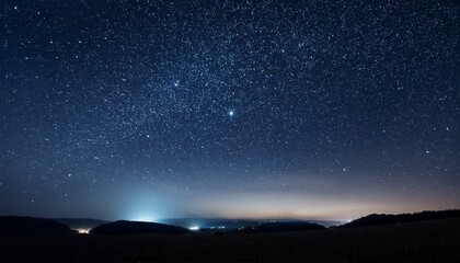 Fototapeta premium a vast field of stars twinkles in the dark night sky creating a mesmerizing view of outer space cosmic wonder and serenity