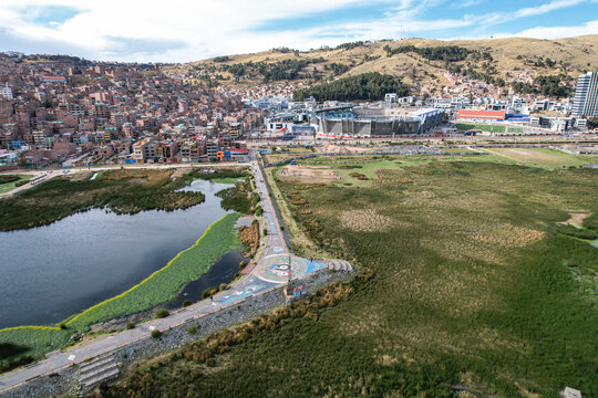 Aerial view of a boardwalk built in the middle of a lake with embankments and riprap