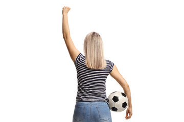 Rear view shot of a happy young woman cheering with a football