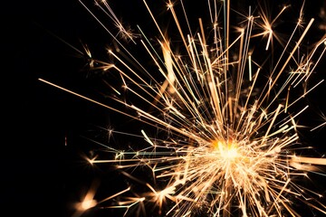 sparkler on a black background close-up. new year