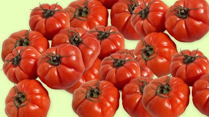 Ripe red heirloom tomatoes on light background