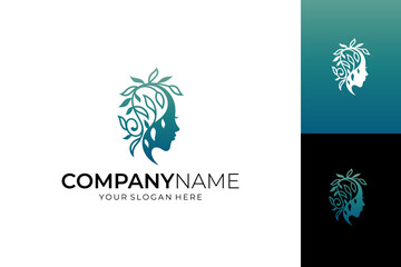 Obraz premium Women's beauty and health logo template with a woman's head silhouette concept and leaf decoration.