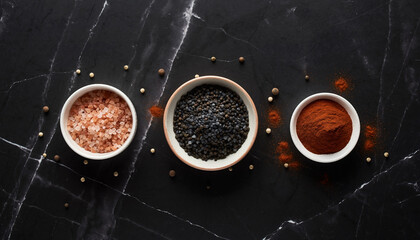 Overhead Flat Lay of Exotic Salts and Spices on Dark Marble