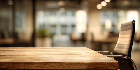 Wooden table and chair in a blurred, bright, modern office setting