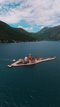 Church of Our Lady of the Rock at Perast Town in Kotor Bay in Montenegro on sunny day