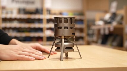 Innovative ai generated camping stove demonstration indoor workshop video content interactive environment close-up viewpoint