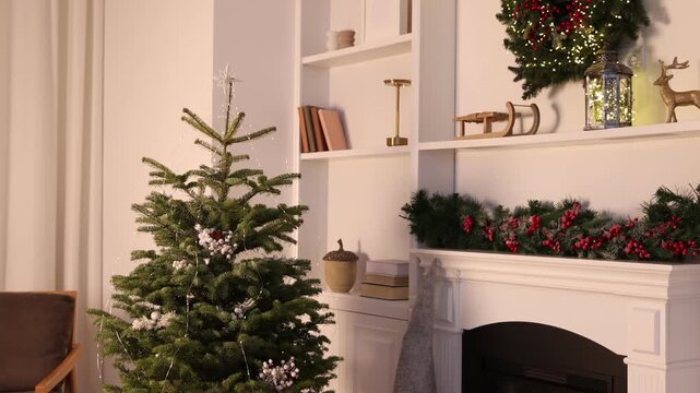 Beautiful Christmas tree and decorative gnome near fireplace at home