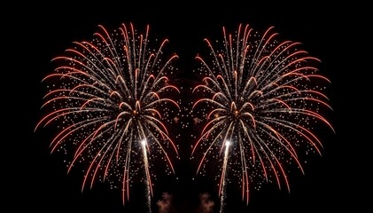 Red and gold fireworks isolated on black
