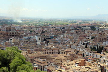 Naklejka premium Granada Cathedral with mountain Landscape from Alhambra – Granada, Spain, July 2024