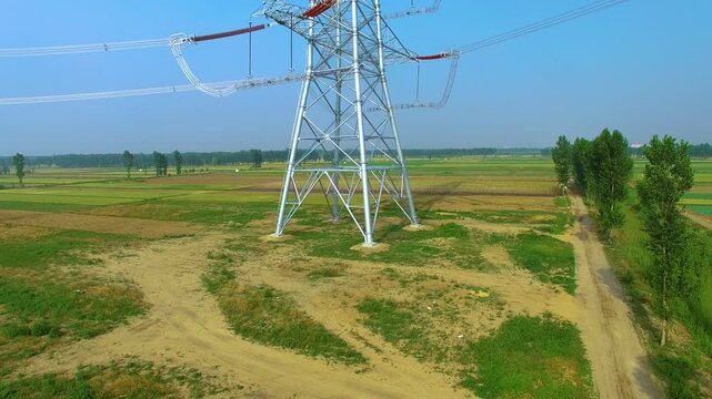 High Voltage Power Tower 295kV Commissioning Job in Agricultural Landscape