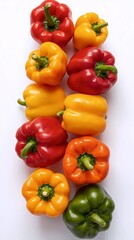 Fresh Assortment of Colorful Bell Peppers in a Vertical Arrangement on a White Background