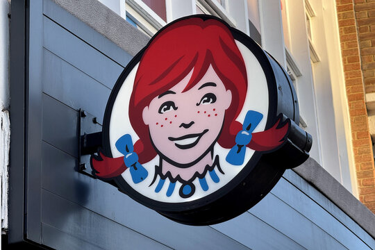 London, UK - December 19 2025: Illustrative editorial Wendy&rsquo;s fast food restaurant logo sign mounted on building exterior