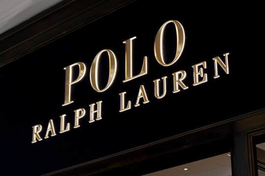 London, UK - December 18 2025: Illustrative editorial Polo Ralph Lauren logo illuminated on luxury fashion store signage at night