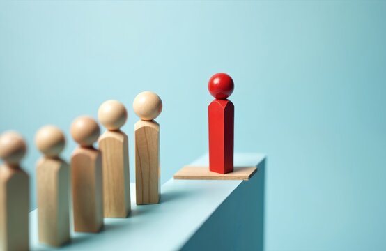 Wooden figures stand in line, one red person leads ahead on a small bridge gap. Represents leadership, risk, and unique choices in business.