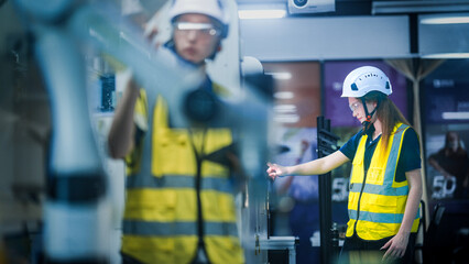 A female engineer represents the future of work, using artificial intelligence and robotics to...