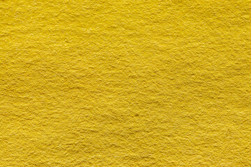 ざらざらした黄色の壁