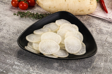 Sliced white daikon radish in the bowl