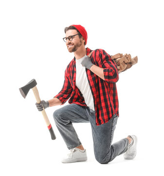 Handsome lumberjack with ax and firewood on white background