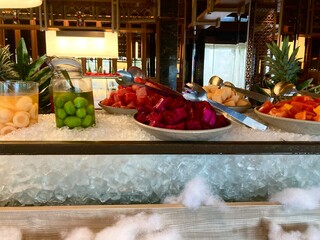 fresh cut tropical fruits served on ice bed at luxury hotel buffet breakfast