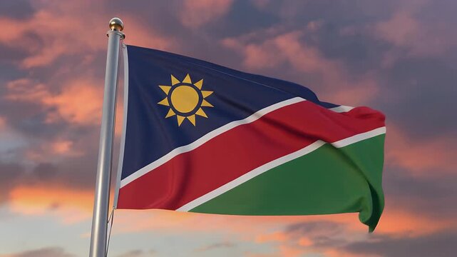 Namibia flag waving against vibrant sunset sky with orange clouds
