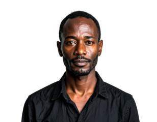 Man in dark collared shirt, serious expression, dark skin