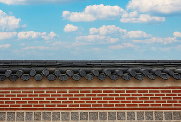 Historic Stone Wall of Gyeongbokgung Palace Showcasing Traditional Korean Masonry under Clear Blue Sky