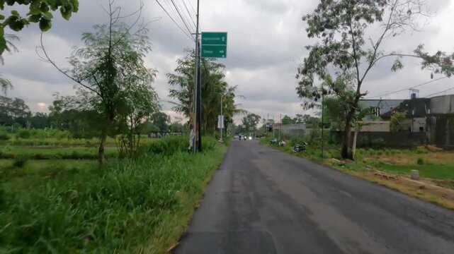 POV Motorcycle Riding: Java, Indonesia, South East Asia: Daytime POV Motorcycle Journey in Wide Farmland