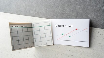 Market Trend Visualization with Observational Data and Graphical Representation on Desk Background