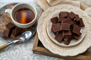 Chocolate fudge, freshly made small squared of pure fudge. Place and coffee or tea setting with a decadent dessert. 