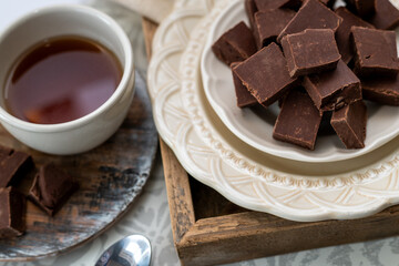 Chocolate fudge, freshly made small squared of pure fudge. Place and coffee or tea setting with a decadent dessert. 
