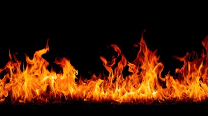 Fototapeta premium Intense fire flames isolated on black background with dynamic orange and yellow tones. STEM education sheets, lab safety posters, designed for STEM education and laboratory safety posters.