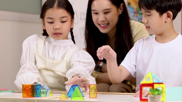 Children and Teacher Engaged in Creative STEM Block Activity