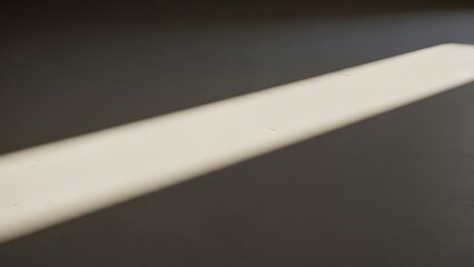 Minimalist Light Beam on Dark Surface in Modern Interior