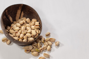 Shelled pistachios in a coconut vase