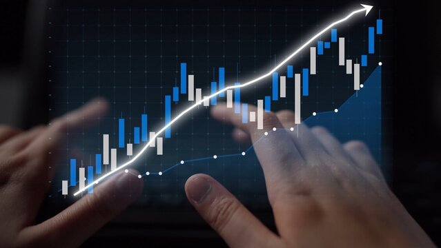 A close-up view of hands interacting with a digital screen displaying a financial graph representing a positive trend in the stock market and trading data. Copula - Powered by Adobe