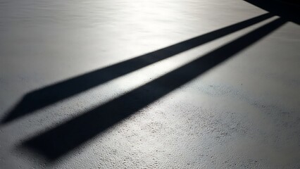 Shadow of Window Frame Cast on White Wall in Bright Natural Light