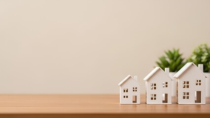 ミニチュアの家が並ぶシンプルな住まいイメージ