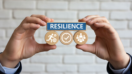 Resilience business for sustainable and inclusive growth concept. Resillient organization. Business person holding blocks with icons sees the word RESILIENCE, Business Resilience and Adaptability