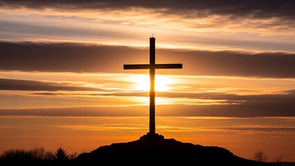 Silhouette of Christian cross against a breathtaking sunset, symbolizing faith and hope in a