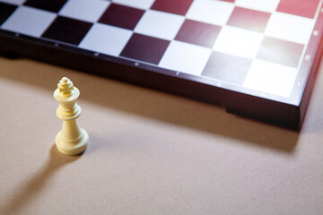 Chess board and chess pieces on the table. The concept of business success.