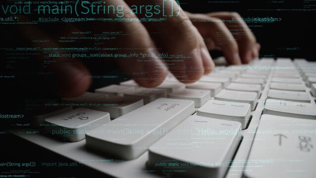 Close-up of hands typing on a keyboard, surrounded by lines of programming code. This image captures the essence of technology and software development in action. Xenic
